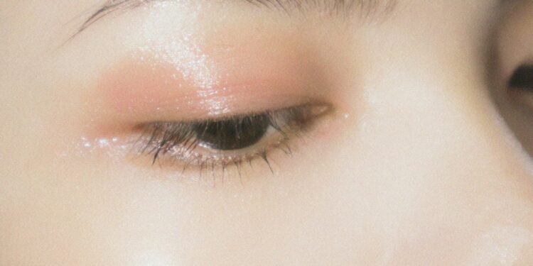 a close up of a woman's eye with makeup