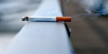 white cigarette stick on white wall